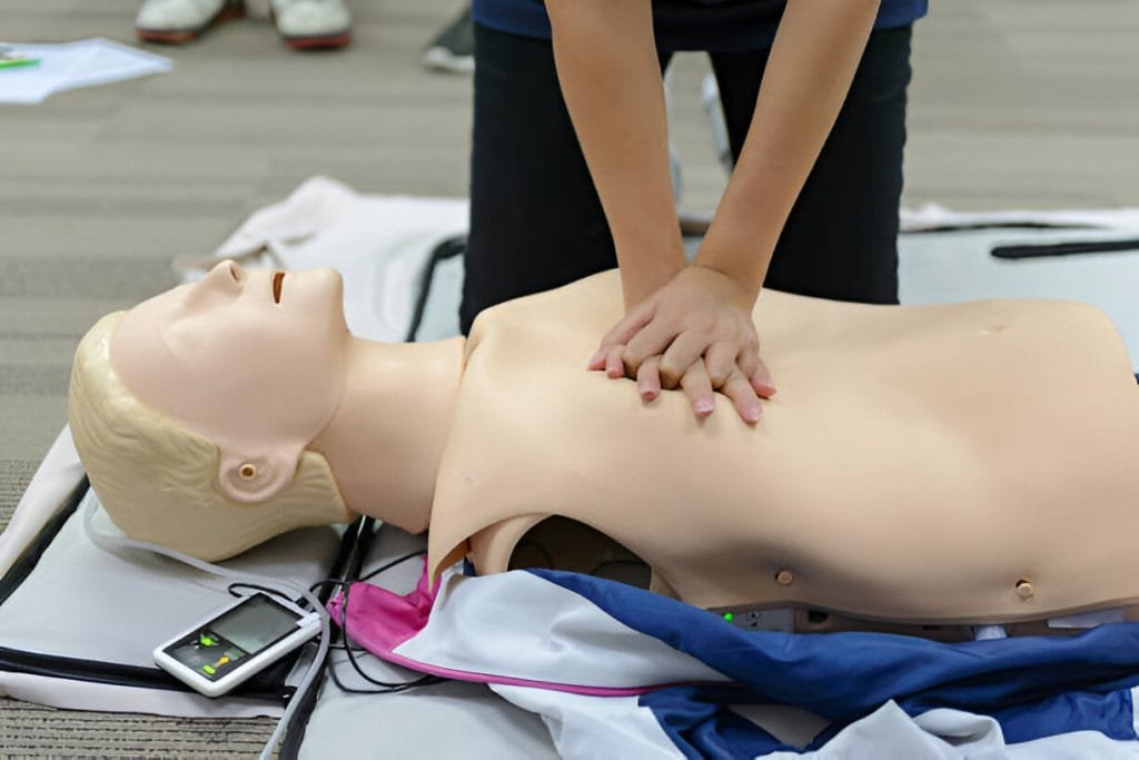CPR First Aid Training with CPR dummy 